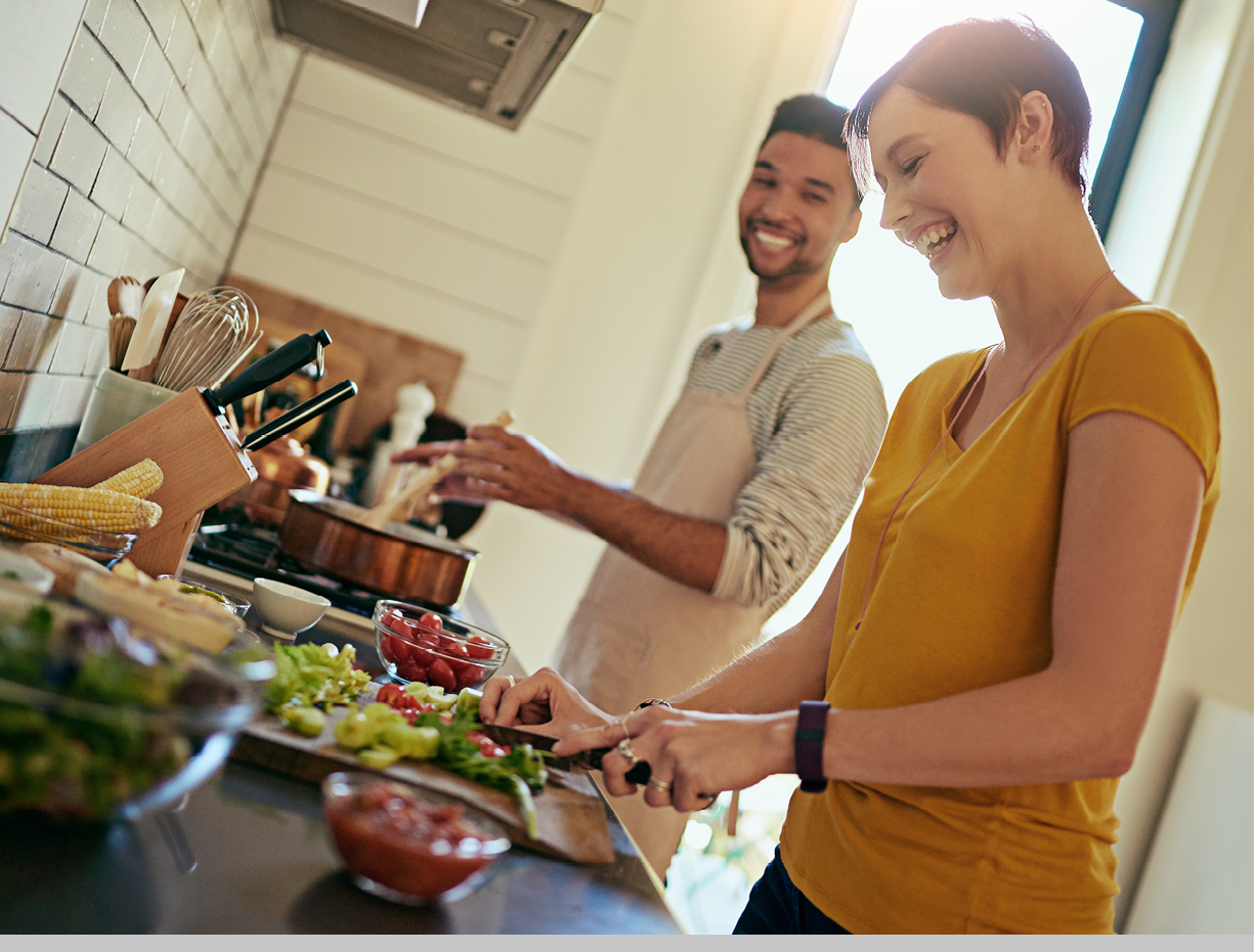 Cover image: Two adult friends are cooking together in a home kitchen.